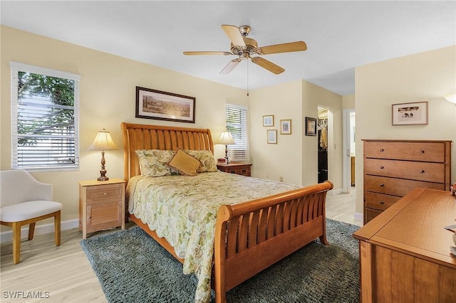 bedroom featuring light wood-type flooring and ceiling fan