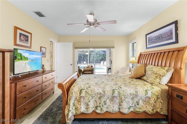 bedroom featuring ceiling fan, access to exterior, and light hardwood / wood-style floors