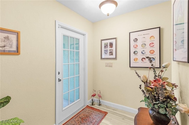 entryway with light hardwood / wood-style floors