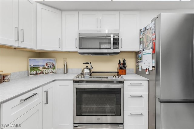 kitchen with white cabinetry and stainless steel appliances