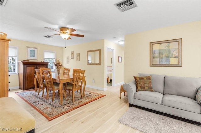 dining space featuring light hardwood / wood-style floors and ceiling fan