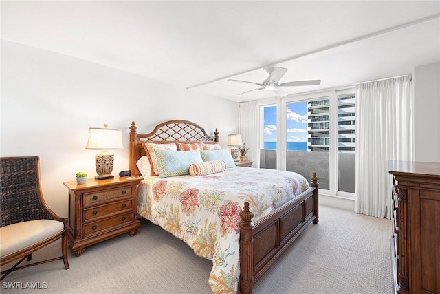 bedroom with ceiling fan and light colored carpet