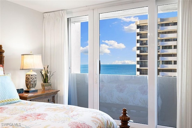 bedroom featuring a water view