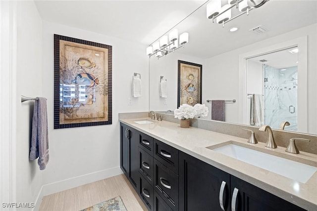 bathroom featuring walk in shower and vanity