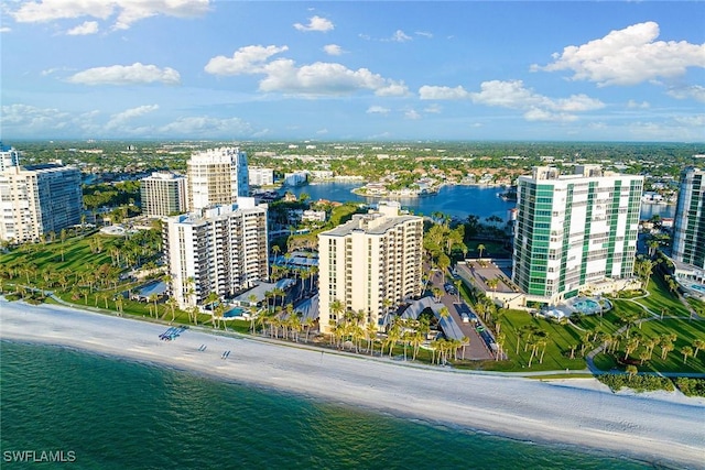 aerial view with a water view and a view of the beach