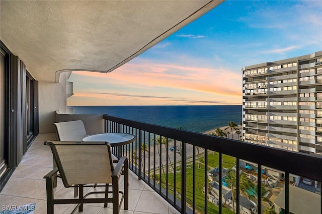 balcony at dusk with a water view