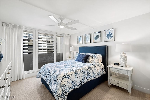 bedroom featuring ceiling fan and light colored carpet