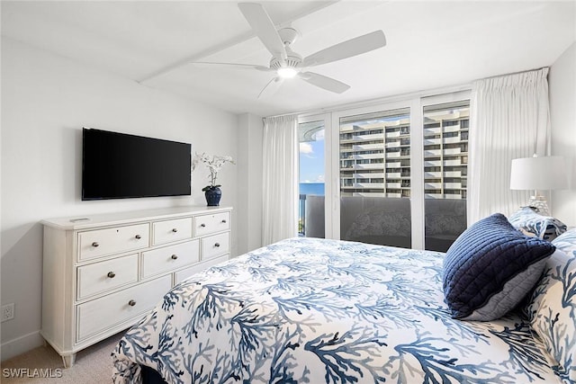 bedroom featuring light colored carpet, access to exterior, and ceiling fan