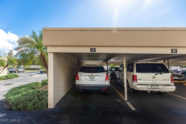 view of vehicle parking featuring a carport