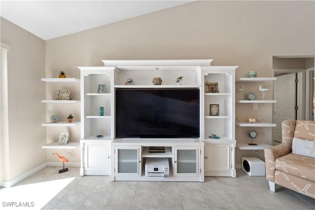 living room featuring lofted ceiling