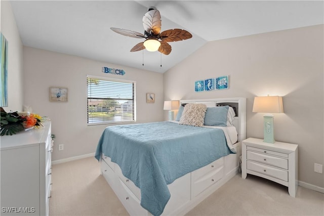 carpeted bedroom with lofted ceiling and ceiling fan