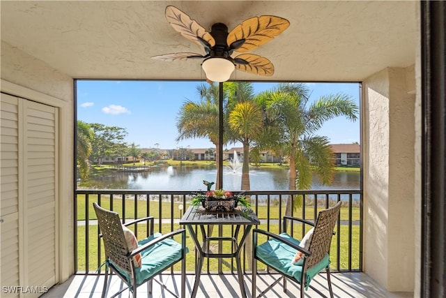 balcony featuring a water view