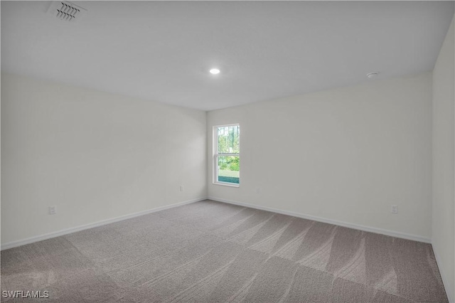 empty room featuring carpet floors