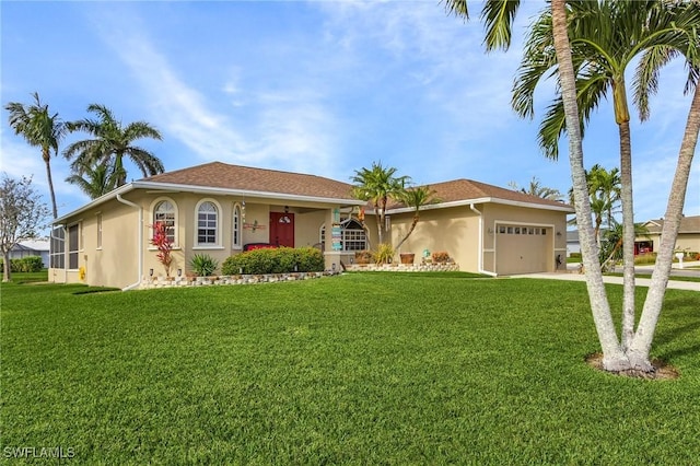 view of front of property featuring a garage and a front yard