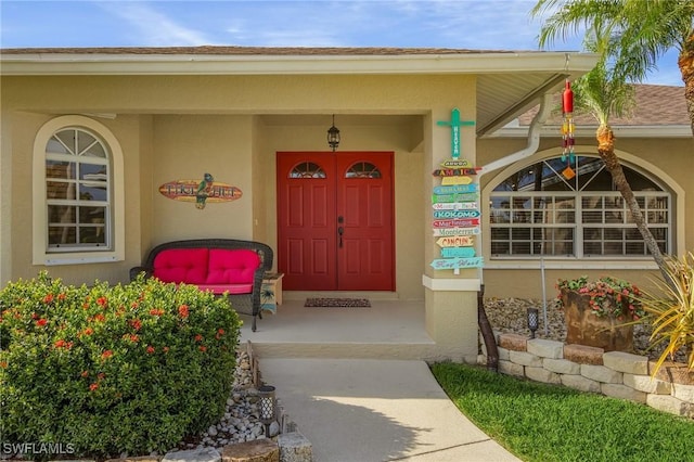 entrance to property featuring covered porch