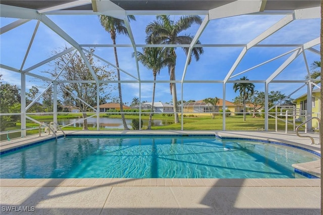 view of pool featuring a patio, a water view, glass enclosure, and a lawn