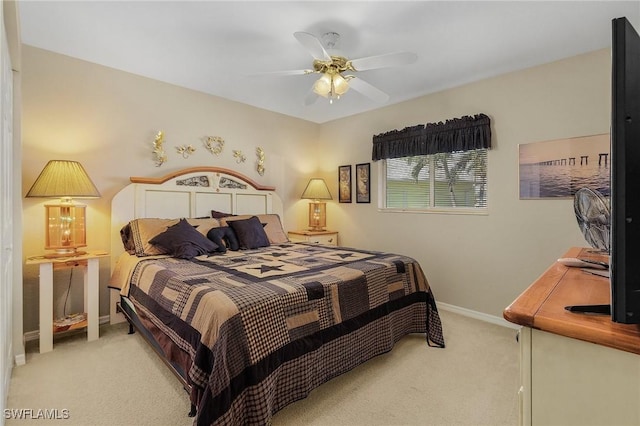 bedroom with light carpet and ceiling fan