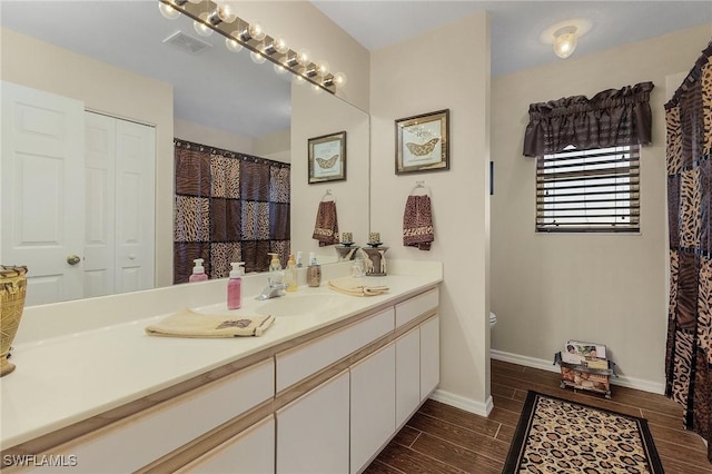 bathroom with toilet and vanity