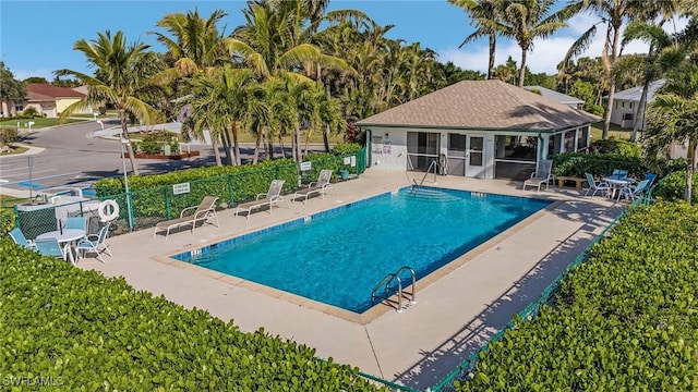 view of swimming pool featuring a patio area