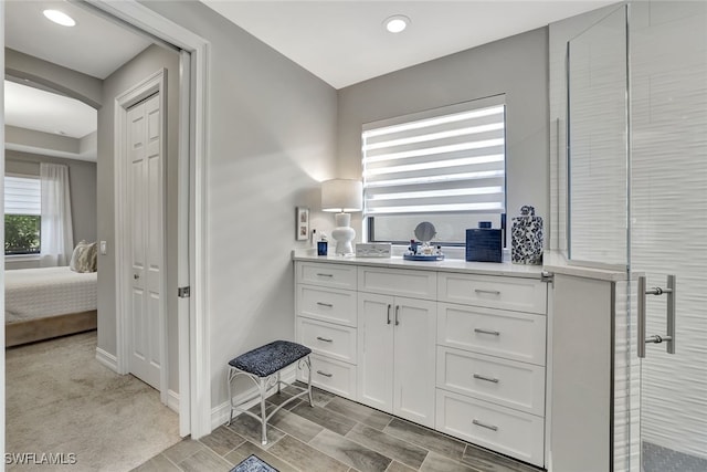 bathroom with vanity and walk in shower