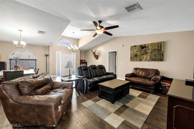 living room featuring lofted ceiling, dark hardwood / wood-style flooring, and ceiling fan with notable chandelier