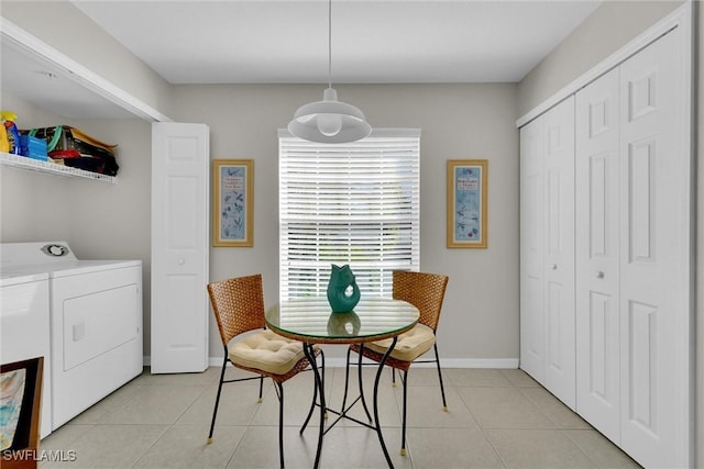 tiled dining space with independent washer and dryer