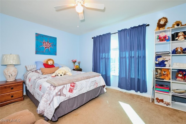 bedroom featuring light colored carpet and ceiling fan