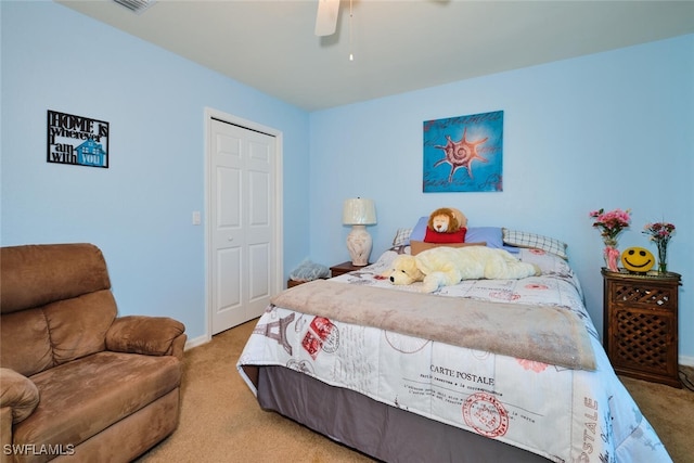 bedroom with light carpet and ceiling fan