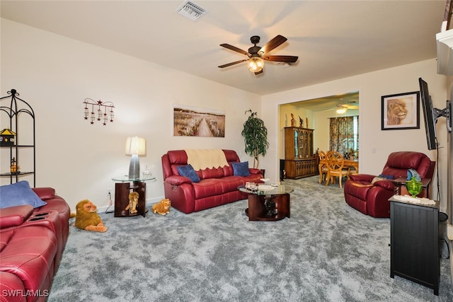 carpeted living room featuring ceiling fan