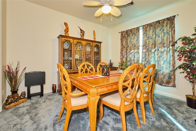 dining space with carpet and ceiling fan