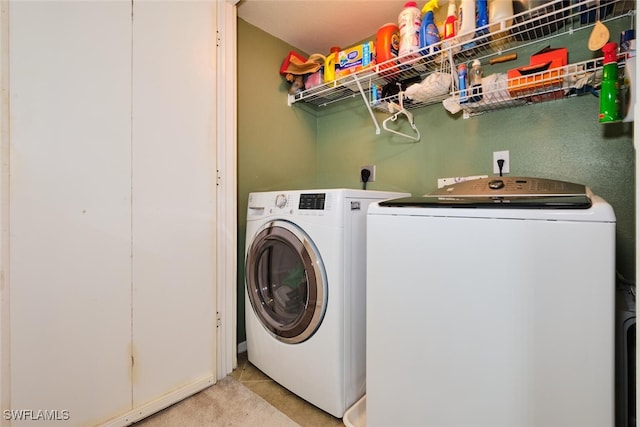 clothes washing area with independent washer and dryer