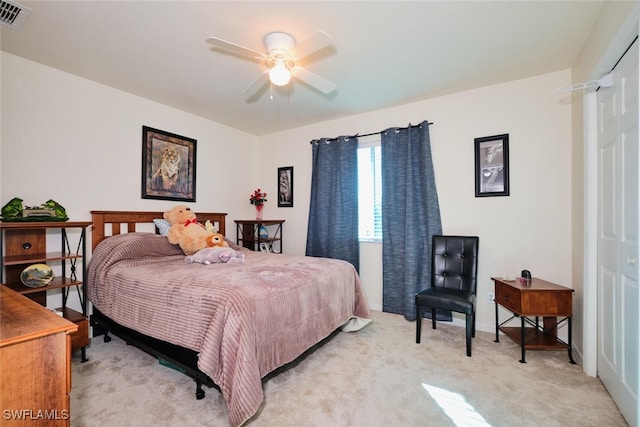 bedroom featuring ceiling fan and light colored carpet