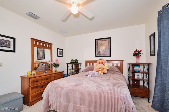 bedroom with ceiling fan and light carpet