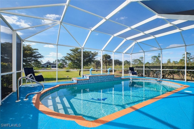 view of pool with a patio and glass enclosure