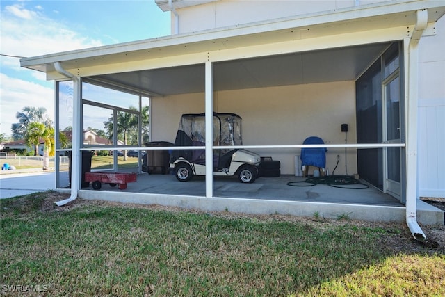 view of parking / parking lot featuring a yard