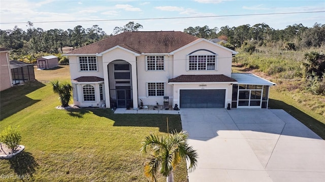 view of front property featuring a garage and a front lawn