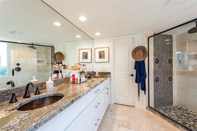 bathroom featuring an enclosed shower and vanity