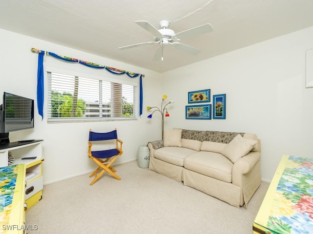 carpeted living room featuring ceiling fan