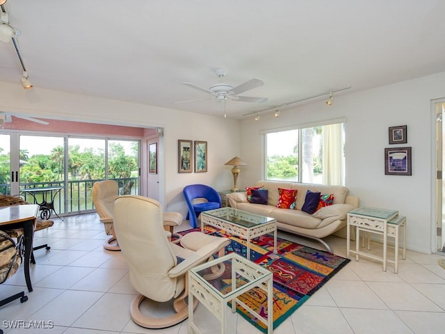 tiled living room with ceiling fan and track lighting