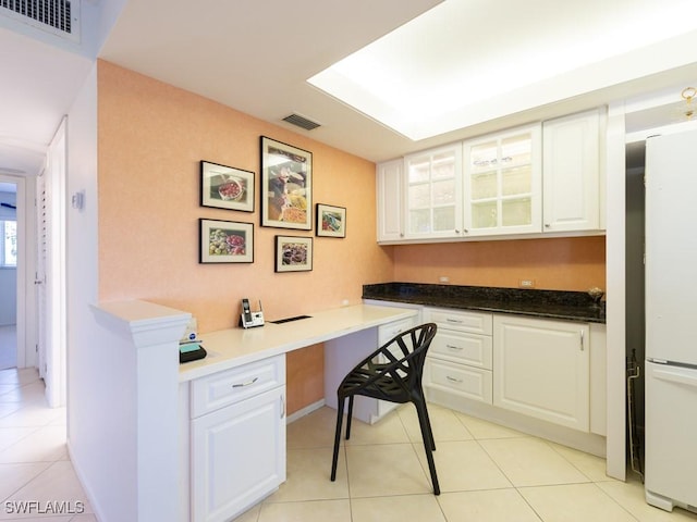 tiled home office featuring built in desk