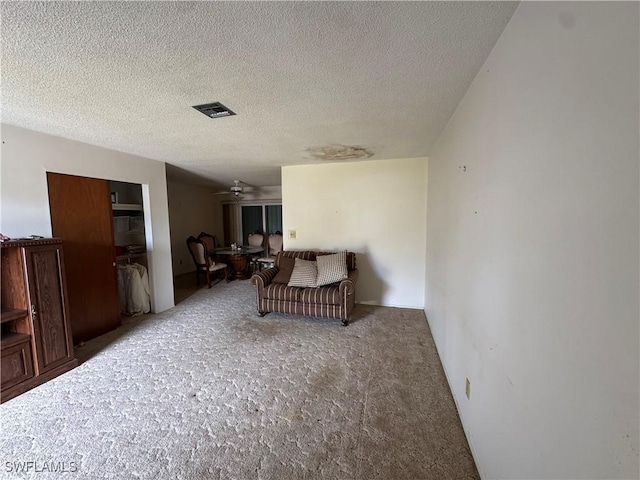 living area with a textured ceiling