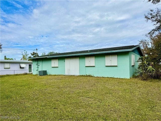 rear view of property with a yard