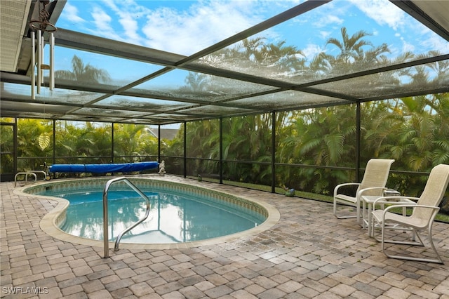 view of pool featuring a lanai and a patio area