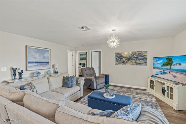 living room featuring hardwood / wood-style floors and a chandelier