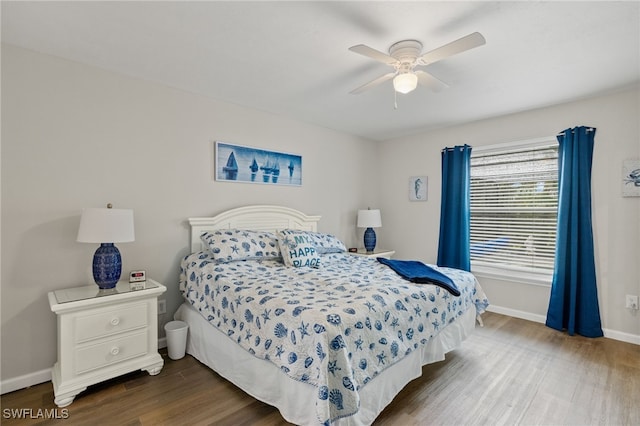 bedroom featuring hardwood / wood-style flooring and ceiling fan