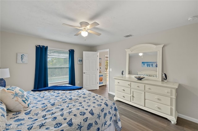 bedroom with dark wood-type flooring and ceiling fan