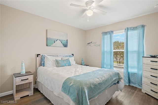 bedroom with ceiling fan and dark hardwood / wood-style floors