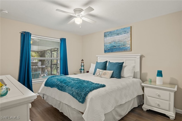 bedroom featuring dark hardwood / wood-style floors and ceiling fan