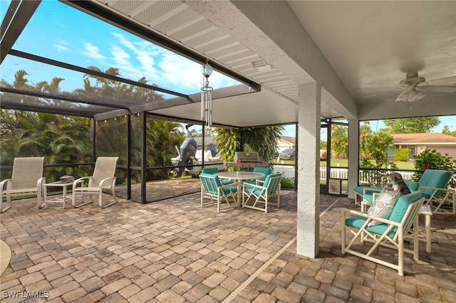 view of patio / terrace featuring a lanai and ceiling fan