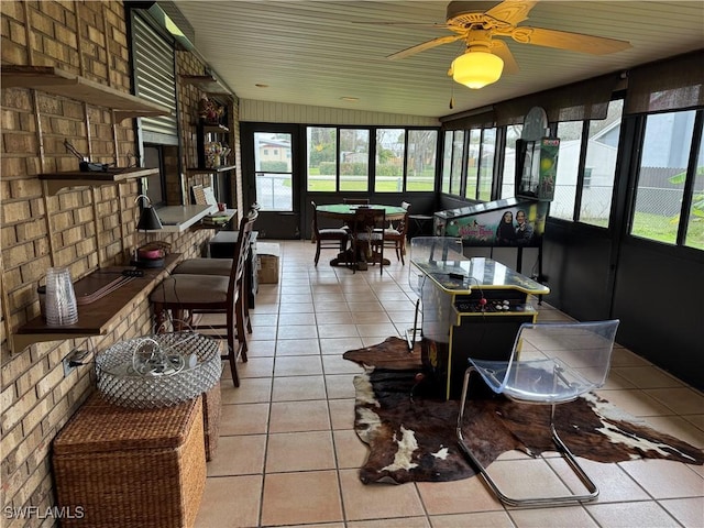 sunroom / solarium with ceiling fan